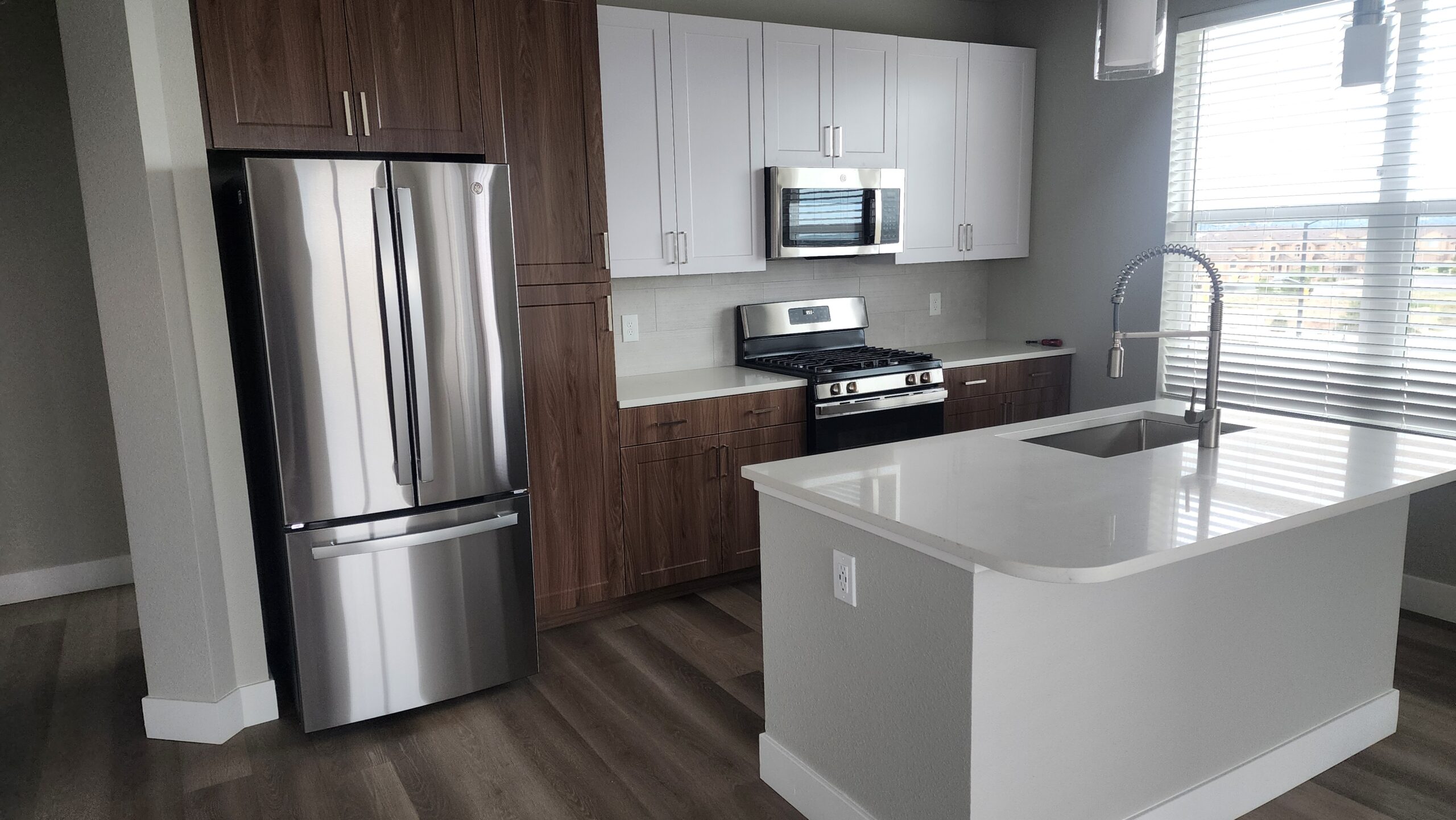 Luxury appliance installation by AKK — Sub-Zero refrigerator and Wolf range in Colorado Springs kitchen