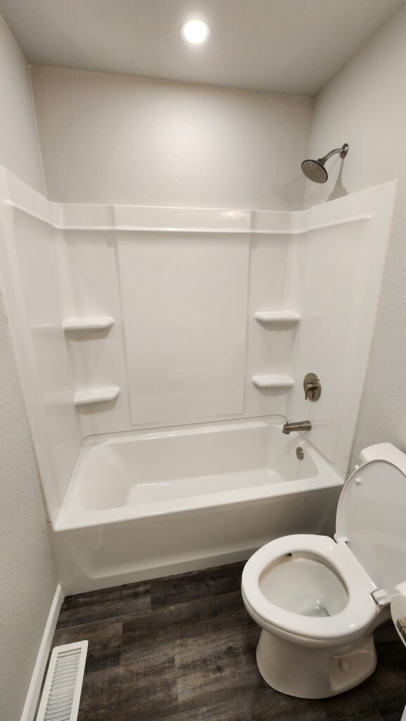 Multi-room renovation project showing kitchen and bathroom improvements